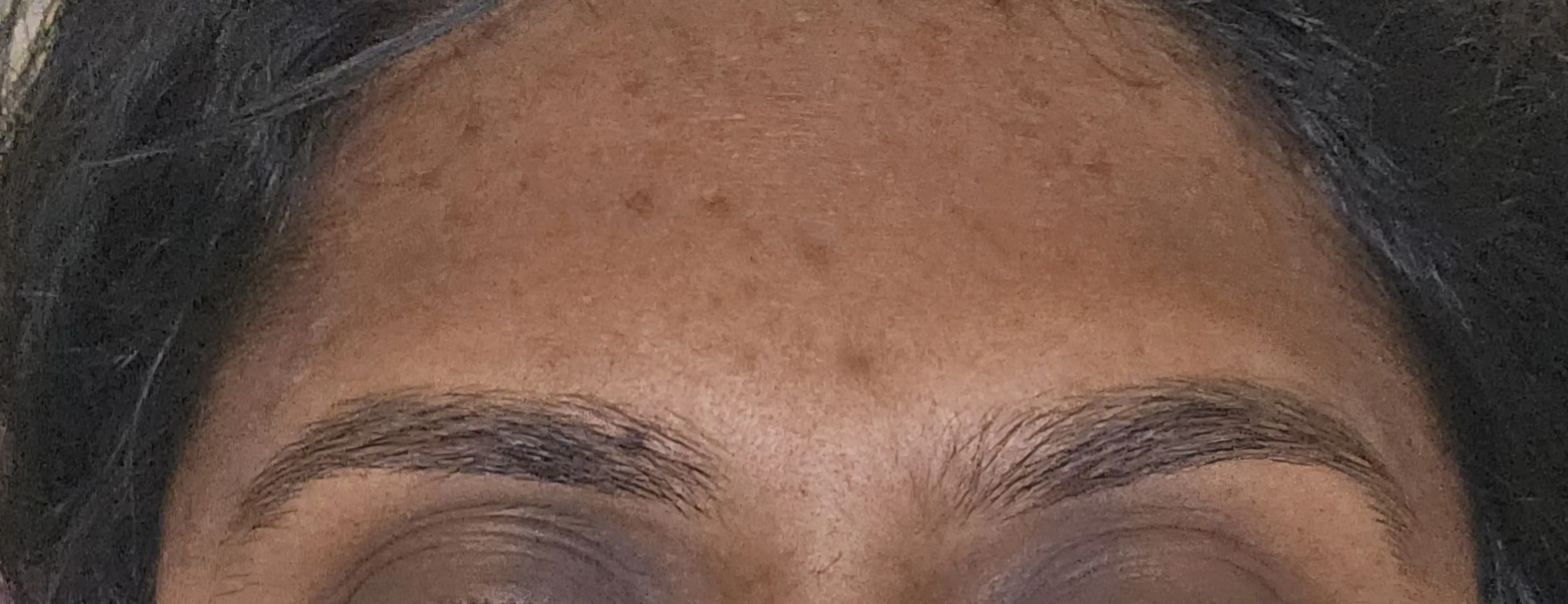 Sculpted brows framing the face